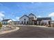 Modern white farmhouse style community building with stone accents and gray trim at 9836 Mount Kataka Pt, Littleton, CO 80125