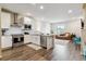 Bright, open kitchen featuring modern appliances and seamless flow to the living area at 9836 Mount Kataka Pt, Littleton, CO 80125