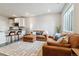 Inviting living area featuring a modern open-concept design and comfortable seating at 9836 Mount Kataka Pt, Littleton, CO 80125