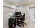 A functional office space has an adjustable desk, ergonomic chair, and modern desk lamp at 9836 Mount Kataka Pt, Littleton, CO 80125