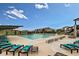 Resort-style pool with plenty of lounge chairs at 9836 Mount Kataka Pt, Littleton, CO 80125