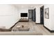 Finished basement with entertainment area, modern lighting, and stylish furniture at 3731 N Race St, Denver, CO 80205