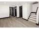 Finished basement with light wood vinyl flooring and multiple doorways at 3731 N Race St, Denver, CO 80205