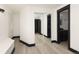 Finished basement featuring a hallway with a closet and built in bench at 3731 N Race St, Denver, CO 80205