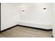Open finished basement area featuring built-in seating, vinyl floor, and sleek lighting at 3731 N Race St, Denver, CO 80205