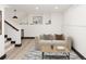 Finished basement with neutral decor, modern lighting, and stylish furniture at 3731 N Race St, Denver, CO 80205