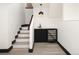 Basement area featuring a bar with sink, beverage cooler, and modern light fixture at 3731 N Race St, Denver, CO 80205
