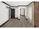 Bright bedroom with brick accent wall and mirrored closet at 3731 N Race St, Denver, CO 80205