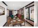 Inviting dining area with exposed brick wall, modern decor, and ample natural light at 3731 N Race St, Denver, CO 80205