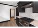 The kitchen features a stainless steel oven range and black cabinets at 3731 N Race St, Denver, CO 80205