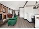Spacious living room with brick accents, open layout, and sleek floors at 3731 N Race St, Denver, CO 80205