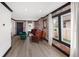 Bright living room with hardwood floors, brick accents and stylish furniture at 3731 N Race St, Denver, CO 80205