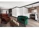 Open-concept living room featuring brick accents, sleek floors, and modern lighting at 3731 N Race St, Denver, CO 80205