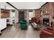 Inviting living room with brick accent wall, fireplace, and modern decor at 3731 N Race St, Denver, CO 80205