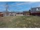 Large backyard featuring a patio, solar panels, a pergola, and a partial fence at 17934 E Purdue Pl, Aurora, CO 80013