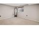 Bedroom featuring neutral walls, carpet floors, a window, and a mirror at 17934 E Purdue Pl, Aurora, CO 80013