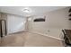 Bedroom featuring neutral walls, carpet floors, a closet, and a small window at 17934 E Purdue Pl, Aurora, CO 80013