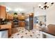 Functional kitchen with stainless steel appliances, oak cabinets, and a spacious layout for cooking at 17934 E Purdue Pl, Aurora, CO 80013