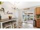 Cozy eat-in kitchen featuring a dining table, natural light, and access to the sunroom at 17934 E Purdue Pl, Aurora, CO 80013