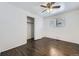 Bedroom with wood flooring, closet, and a sunny window at 7930 Poplar St, Commerce City, CO 80022