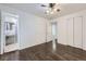 Spacious bedroom with ceiling fan, connecting ensuite bathroom and closet at 7930 Poplar St, Commerce City, CO 80022