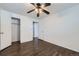 Bedroom featuring closet, lighting, and hardwood flooring at 7930 Poplar St, Commerce City, CO 80022