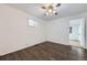 Cozy bedroom boasts natural light and wood floors at 7930 Poplar St, Commerce City, CO 80022