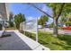 Front view of a charming house with a well-manicured lawn, mature trees, and inviting curb appeal at 7930 Poplar St, Commerce City, CO 80022
