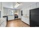 Bright kitchen with updated cabinets, countertops and flooring offers modern convenience at 7930 Poplar St, Commerce City, CO 80022