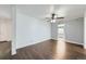 Stylish living room with ceiling fan, great floors, and seamless flow into adjacent rooms at 7930 Poplar St, Commerce City, CO 80022