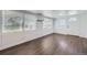 An open concept living room with lots of light and luxury vinyl flooring at 7930 Poplar St, Commerce City, CO 80022