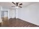 Inviting living room with ceiling fan, beautiful floors, and a comfortable, welcoming space at 7930 Poplar St, Commerce City, CO 80022