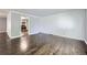 Spacious living room with hardwood floors and neutral paint, offering a versatile living space at 7930 Poplar St, Commerce City, CO 80022