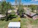 Backyard aerial view with a well-maintained yard, mature trees, and storage shed at 10220 W Montgomery Ave, Littleton, CO 80127