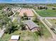 Aerial view of horse property with arena, pastures, outbuildings, and a ranch-style home at 10220 W Montgomery Ave, Littleton, CO 80127
