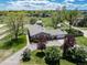 Aerial view of a charming one story home with mature landscaping and a large driveway at 10220 W Montgomery Ave, Littleton, CO 80127