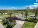 Charming ranch-style home features a well-manicured lawn, mature trees, and a spacious driveway leading to an attached two-car garage at 10220 W Montgomery Ave, Littleton, CO 80127