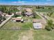Expansive property featuring a ranch house, outbuildings, horse arena, and fenced pastures at 10220 W Montgomery Ave, Littleton, CO 80127