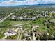Scenic aerial view of a suburban neighborhood with tree-lined streets and sprawling green fields at 10220 W Montgomery Ave, Littleton, CO 80127