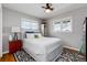 Cozy bedroom with a queen-sized bed, soft textures, and a bright window at 10220 W Montgomery Ave, Littleton, CO 80127