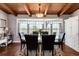 Elegant dining room with a bay window, hardwood floors, and stylish decor at 10220 W Montgomery Ave, Littleton, CO 80127