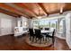 Open dining area with a bay window, hardwood floors and a built in bench at 10220 W Montgomery Ave, Littleton, CO 80127