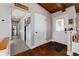Inviting entryway with hardwood floors, a wooden ceiling, and a neutral color scheme at 10220 W Montgomery Ave, Littleton, CO 80127