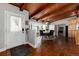 Foyer featuring a wood-paneled ceiling and an inviting dining area, creating a warm and elegant entrance at 10220 W Montgomery Ave, Littleton, CO 80127