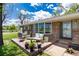 Inviting front porch with comfortable seating, potted plants, and a view of the front yard at 10220 W Montgomery Ave, Littleton, CO 80127