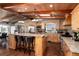 Spacious kitchen with a large island, custom wood cabinets, and modern appliances at 10220 W Montgomery Ave, Littleton, CO 80127