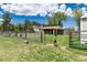 Fenced pasture with livestock and outbuildings, offering ample space for agricultural activities at 10220 W Montgomery Ave, Littleton, CO 80127
