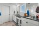 Double vanity bathroom with dark countertops and a walk-in shower at 697 N Bersshine Ct, Watkins, CO 80137