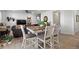Dining area with table and chairs, view into living room at 697 N Bersshine Ct, Watkins, CO 80137