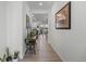 View through entryway to the living room and kitchen at 697 N Bersshine Ct, Watkins, CO 80137
